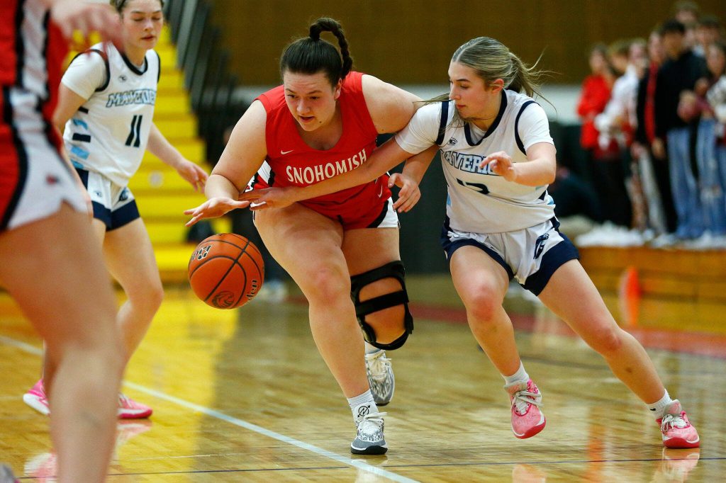 Meadowdales Lexi Zardis tries to steal the ball from Snohomishs Addyson Gallatin during the 3A District One Semifinals on Wednesday, Feb. 14, 2024, at Marysville Pilchuck High School in Marysville, Washington. (Ryan Berry / The Herald)