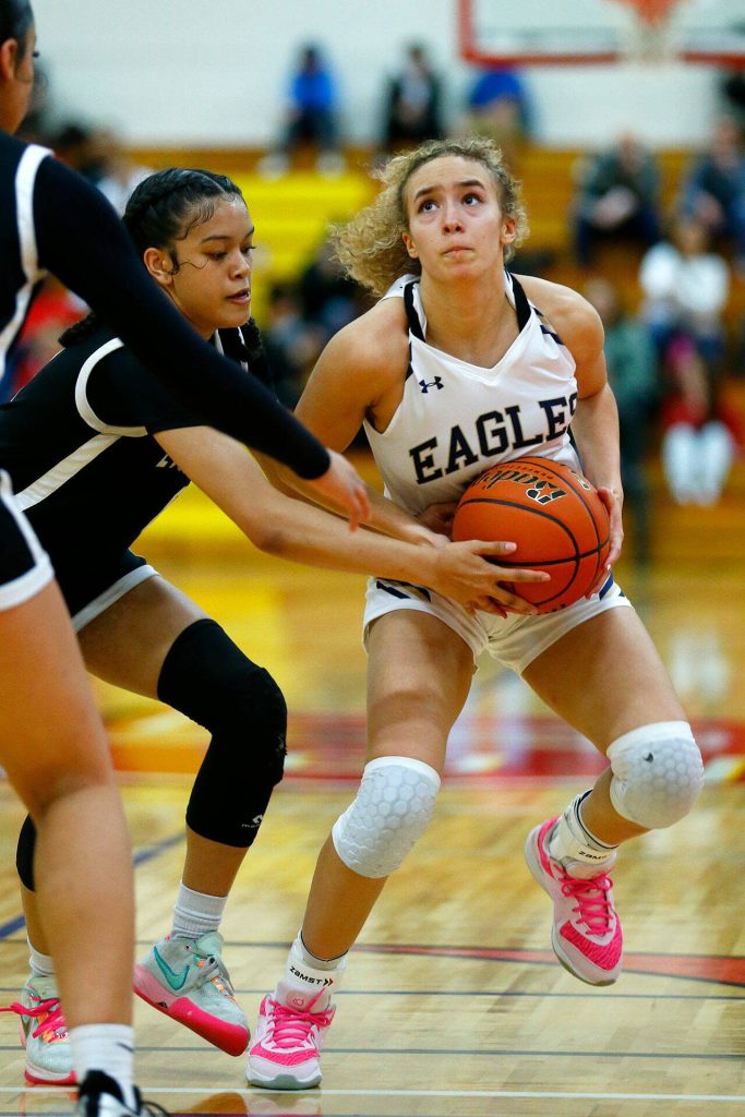 Arlingtons Samara Morrow tries to step back for a shot in the paint against Lynnwood during the 3A District 1 Semifinals on Wednesday at Marysville Pilchuck High School in Marysville. (Ryan Berry / The Herald)