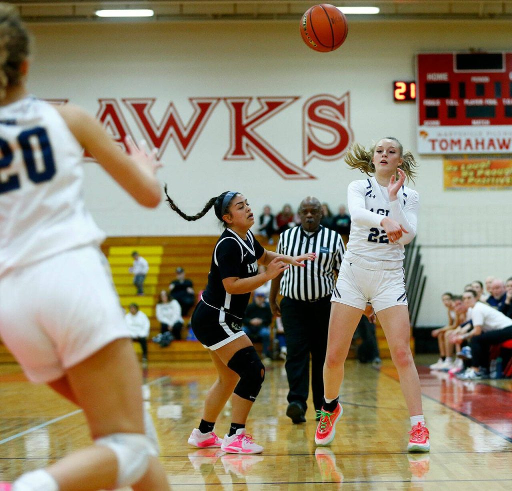 Arlingtons Kierra Reese passes down to the baseline against Lynnwood during the 3A District One Semifinals on Wednesday, Feb. 14, 2024, at Marysville Pilchuck High School in Marysville, Washington. (Ryan Berry / The Herald)