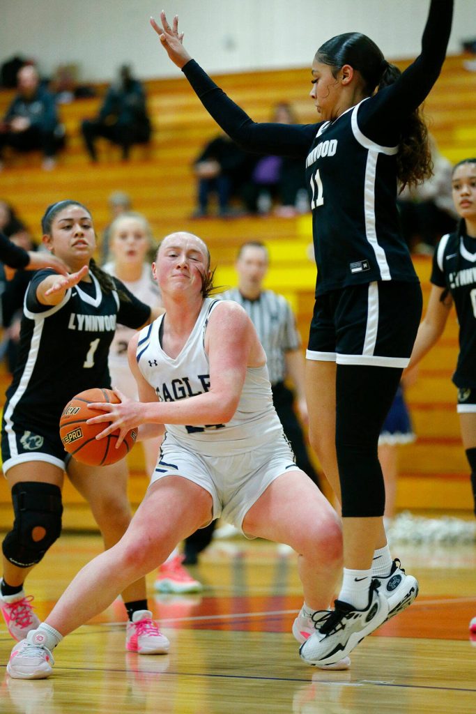 Arlingtons Katie Snow tries to find space for a shot against Lynnwood during the 3A District One Semifinals on Wednesday, Feb. 14, 2024, at Marysville Pilchuck High School in Marysville, Washington. (Ryan Berry / The Herald)