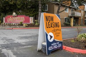 A leasing sign in visible outside of A’cappella Apartment Homes on Wednesday, March 1, 2023 in Everett, Washington. (Olivia Vanni / The Herald)