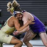 Arlington’s Tre Haines and Oak Harbors Percie Hatfield wrestle during the 3A boys 157-pound championship match during Mat Classic XXXV on Saturday, Feb. 17, 2024, at the Tacoma Dome in Tacoma. (Annie Barker / The Herald)