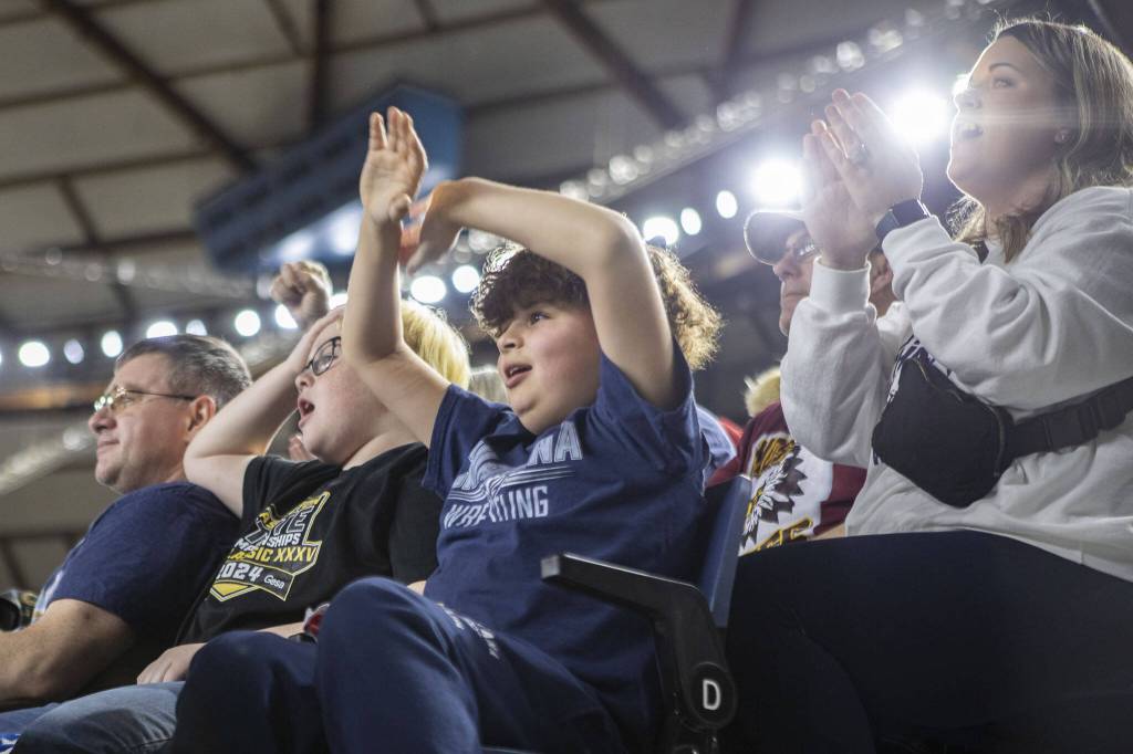 Fans cheer during the Mat Classic XXXV on Saturday, Feb. 17, 2024, at the Tacoma Dome in Tacoma. (Annie Barker / The Herald)