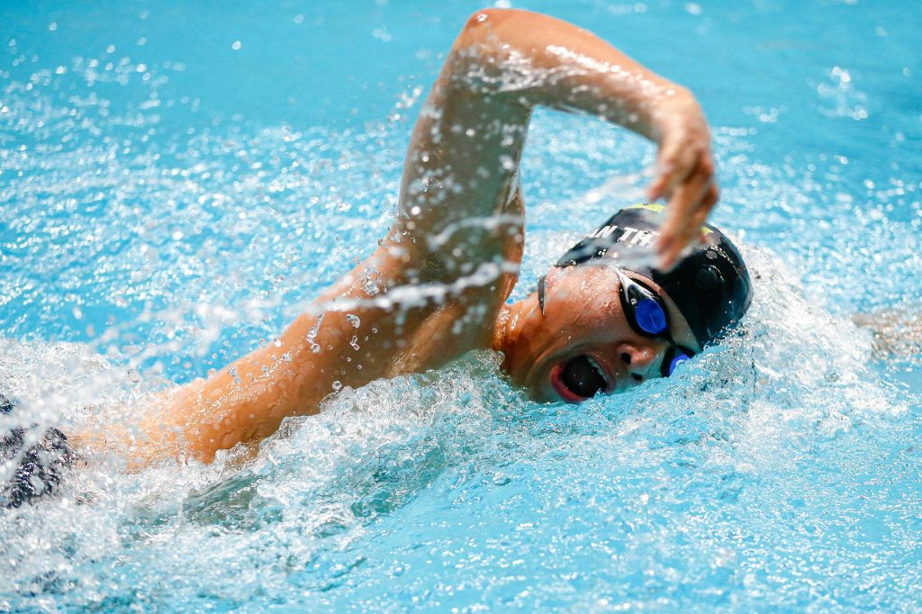 Jackson freshman Nolan Thai swims in the 500 yard freestyle consolation during the WIAA 4A Boys Swim and Dive Championships on Saturday, Feb. 17, 2024, at the Weyerhaeuser King County Aquatic Center in Federal Way, Washington. (Ryan Berry / The Herald)