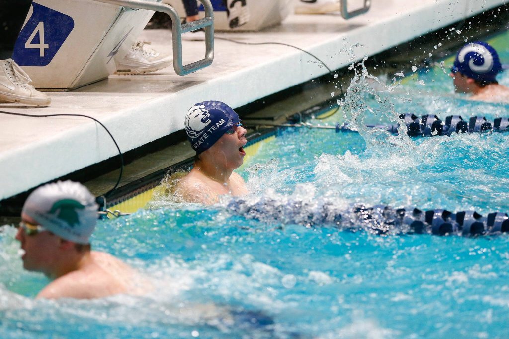 Glacier Peak senior Kaiu Taylor finishes the 50 yard freestyle consolation during the WIAA 4A Boys Swim and Dive Championships on Saturday, Feb. 17, 2024, at the Weyerhaeuser King County Aquatic Center in Federal Way, Washington. (Ryan Berry / The Herald)