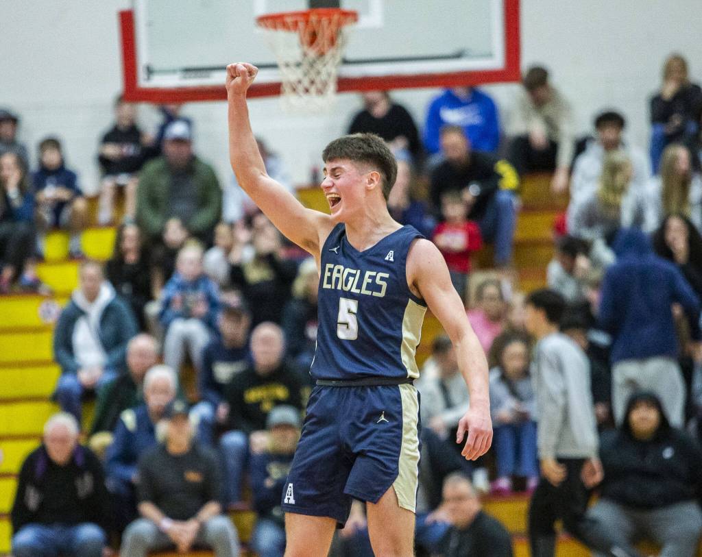 Arlingtons Jacoby Falor celebrates beating Mountlake Terrace in the 3A boys district championship game on Saturday, Feb. 17, 2024 in Marysville, Washington. (Olivia Vanni / The Herald)