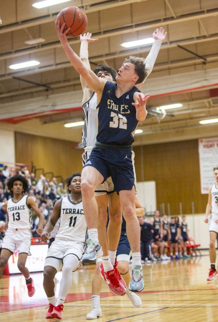 Arlingtons Kaid Hunter attempts a layup during the 3A boys district championship game against Mountlake Terrace on Saturday, Feb. 17, 2024 in Marysville, Washington. (Olivia Vanni / The Herald)