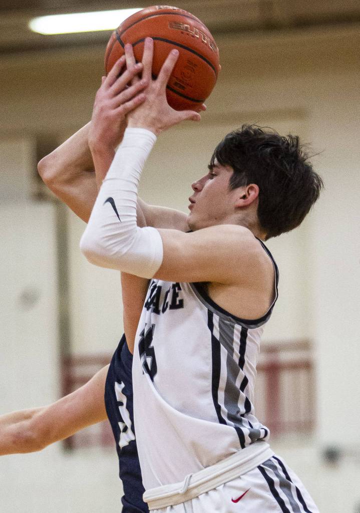 Mountlake Terraces Jaxon Dubiel is fouled while shooting during the 3A boys district championship game against Arlington on Saturday, Feb. 17, 2024 in Marysville, Washington. (Olivia Vanni / The Herald)