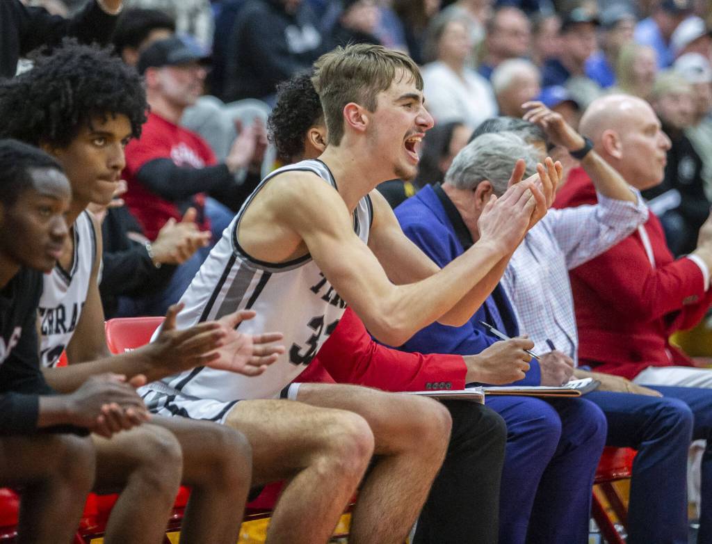 Mountlake Terraces Gabe Towne cheers on his teammates during the 3A boys district championship game against Arlington on Saturday, Feb. 17, 2024 in Marysville, Washington. (Olivia Vanni / The Herald)