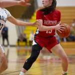 Snohomishs Sienna Capelli looks for an open teammate during the 3A girls district championship game against Arlington on Saturday, Feb. 17, 2024 in Marysville, Washington. (Olivia Vanni / The Herald)