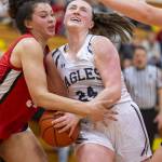 Snohomishs Tyler Gildersleeve-Stiles fouls Arlingtons Katie Snow while she tries to shoot during the 3A girls district championship game on Saturday, Feb. 17, 2024 in Marysville, Washington. (Olivia Vanni / The Herald)
