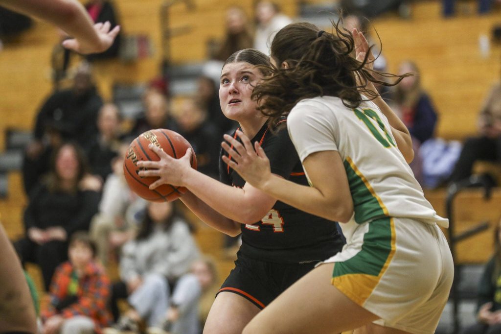 Monroes Brooklyn Krache (24) shoots the ball during a 3A girls game between Monroe and Roosevelt at Roosevelt High School on Tuesday, Feb. 20, 2024, in Seattle, WA. Monroe fell, 58-37. (Annie Barker / The Herald)