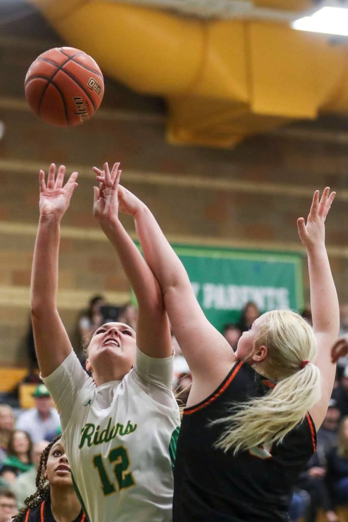 Roosevelt s Ava Dorling (12) shoots the ball during a 3A girls game between Monroe and Roosevelt at Roosevelt High School on Tuesday, Feb. 20, 2024, in Seattle, WA. Monroe fell, 58-37. (Annie Barker / The Herald)