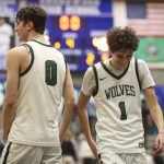 Jackson players celebrate during a state regionals game against Puyallup on Feb. 23 in Shoreline. (Annie Barker / The Herald)