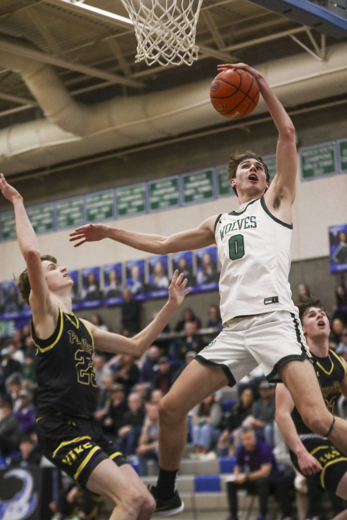 Jacksons Ryan Mcferran (0) shoots the ball during a boys game between Jackson and Puyallup at Shorewood High School on Friday, Feb. 23, 2024, in Shoreline, WA. Jackson won, 55-48. (Annie Barker / The Herald)