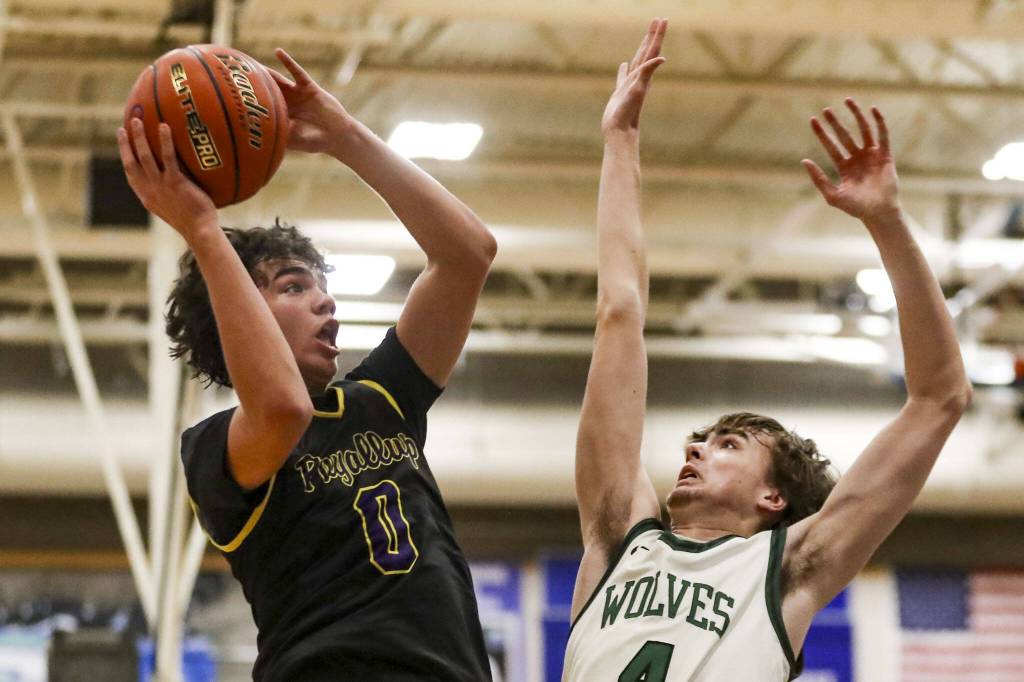 Puyallups Mason Sonntag (0) shoots the ball during a boys game between Jackson and Puyallup at Shorewood High School on Friday, Feb. 23, 2024, in Shoreline, WA. Jackson won, 55-48. (Annie Barker / The Herald)