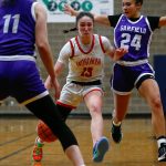 Snohomishs Sienna Capelli tries to make space between defenders against Garfield during a playoff matchup at Arlington High School on Friday, Feb. 23, 2024, in Arlington, Washington. (Ryan Berry / The Herald)
