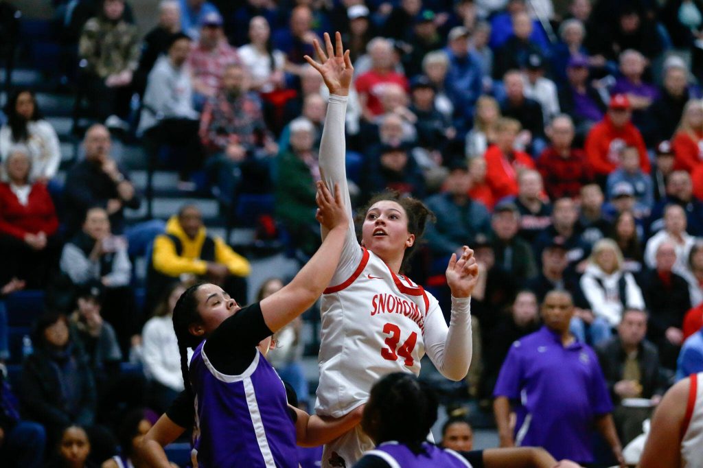 Snohomish junior Tyler Gildersleeve-Stiles takes a shot from the paint against Garfield during a playoff matchup at Arlington High School on Friday, Feb. 23, 2024, in Arlington, Washington. (Ryan Berry / The Herald)