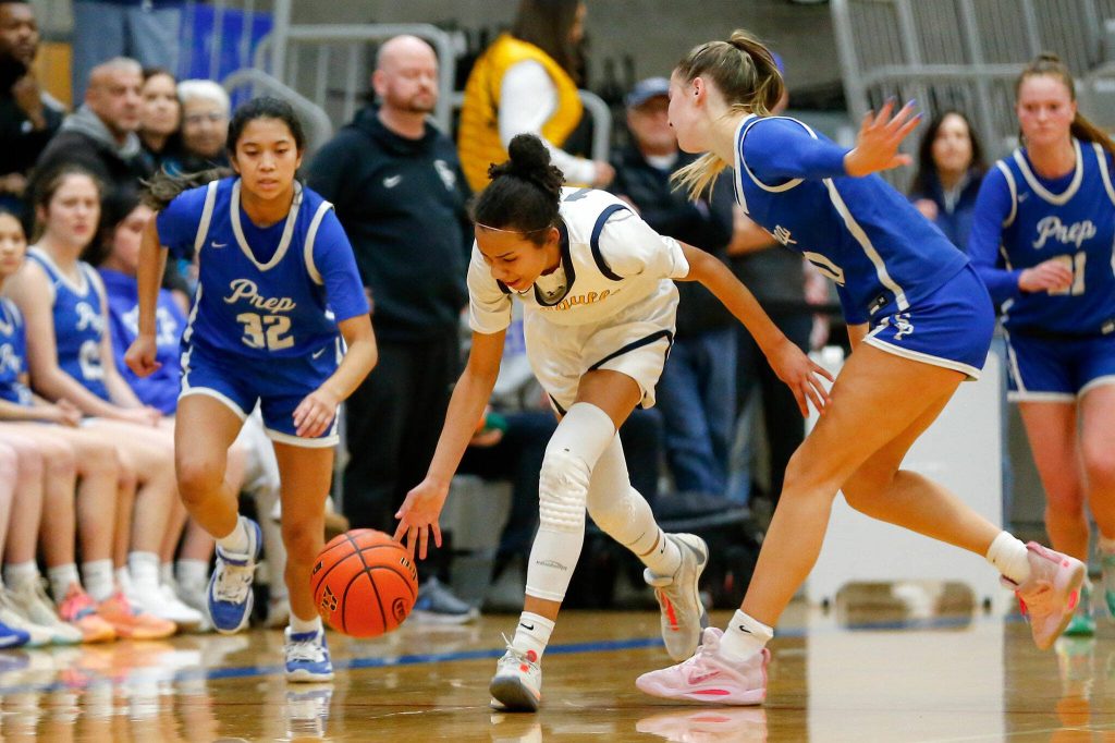 Everetts Mae Washington strips the ball and takes it the other way against Seattle Prep during a playoff matchup at Shorewood High School on Saturday, Feb. 24, 2024, in Shoreline, Washington. (Ryan Berry / The Herald)