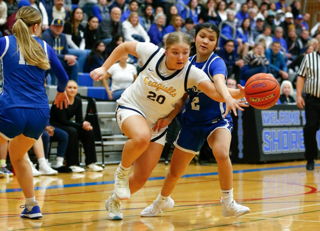 Everett freshman Haylie Oyler tries to go down the baseline through strong defense against Seattle Prep during a playoff matchup at Shorewood High School on Saturday, Feb. 24, 2024, in Shoreline, Washington. (Ryan Berry / The Herald)