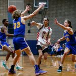 Tulalip Heritage senior Ponciano Guzman dishes to a teammate against Columbia Adventist Academy during a playoff matchup at Arlington High School on Saturday, Feb. 24, 2024, in Arlington, Washington. (Ryan Berry / The Herald)