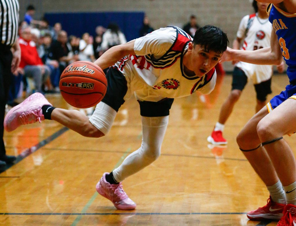 Tulalip Heritage senior Hazen Shopbell drives to the corner against Columbia Adventist Academy during a playoff matchup at Arlington High School on Saturday, Feb. 24, 2024, in Arlington, Washington. (Ryan Berry / The Herald)