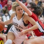 Arlington’s Samara Morrow tries to maneuver around  Snohomish’s Sienna Capelli during the 3A girls district championship game on Saturday, Feb. 17, 2024 in Marysville, Washington. (Olivia Vanni / The Herald)