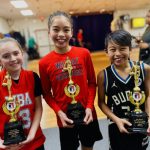 (From left to right) Ellie Matisin, Helaina Soterakopoulos and Max Soterakopoulos pose with their championships trophies after winning their divisions of the Washington State Elks Association Hoop Shoot free-throw competition. (Photo courtesy of Jayne Soterakopoulos)