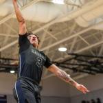 Glacier Peaks Isaiah Cuellar (3) rises up to finish near the hoop during a bi-district title game against Mount Si on Feb. 16 at North Creek High School in Bothell. (Annie Barker / The Herald)