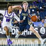 Arlingtons Leyton Martin takes the ball down the court during the 3A boys state basketball game against Garfield on Wednesday in Tacoma. (Olivia Vanni / The Herald)