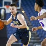 Arlingtons Jackson Trotter takes the ball down the court during the 3A boys state basketball game against Garfield on Wednesday, Feb. 28, 2024 in Tacoma, Washington. (Olivia Vanni / The Herald)