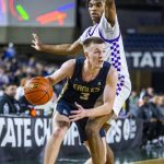 Arlingtons Jackson Trotter looks for an open teammate to pass to during the 3A boys state basketball game against Garfield on Wednesday, Feb. 28, 2024 in Tacoma, Washington. (Olivia Vanni / The Herald)