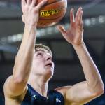 Arlingtons Leyton Martin makes a layup during the 3A boys state basketball game against Garfield on Wednesday, Feb. 28, 2024 in Tacoma, Washington. (Olivia Vanni / The Herald)