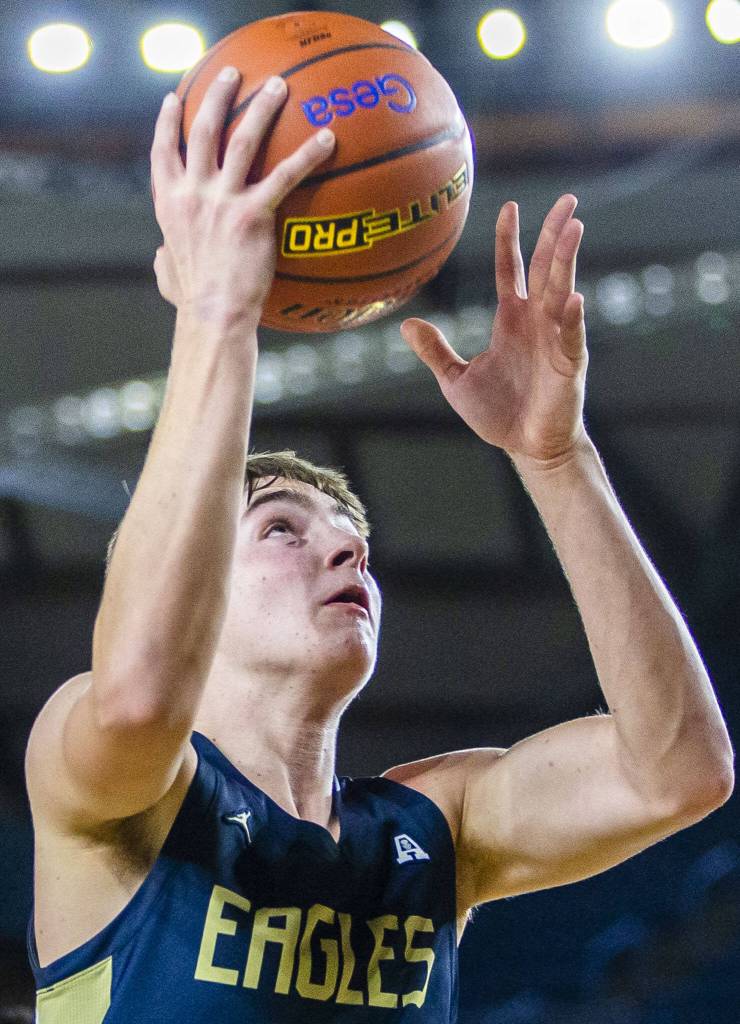 Arlingtons Leyton Martin makes a layup during the 3A boys state basketball game against Garfield on Wednesday, Feb. 28, 2024 in Tacoma, Washington. (Olivia Vanni / The Herald)