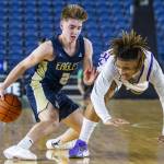 Arlingtons Leyton Martin fakes out Garfields Marcel Jones during the 3A boys state basketball game on Wednesday, Feb. 28, 2024 in Tacoma, Washington. (Olivia Vanni / The Herald)
