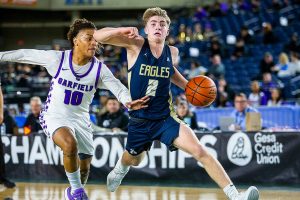 Arlington’s Leyton Martin takes the ball down the court during the 3A boys state basketball game against Garfield on Wednesday, Feb. 28, 2024 in Tacoma, Washington. (Olivia Vanni / The Herald)