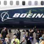 FILE- In this Feb. 5, 2018, file photo a Boeing 737 MAX 7, the newest version of Boeing's fastest-selling airplane, is displayed during a debut for employees and media of the new jet in Renton, Wash. The Boeing Company reports earnings Wednesday, Jan. 30, 2019. (AP Photo/Elaine Thompson, File)