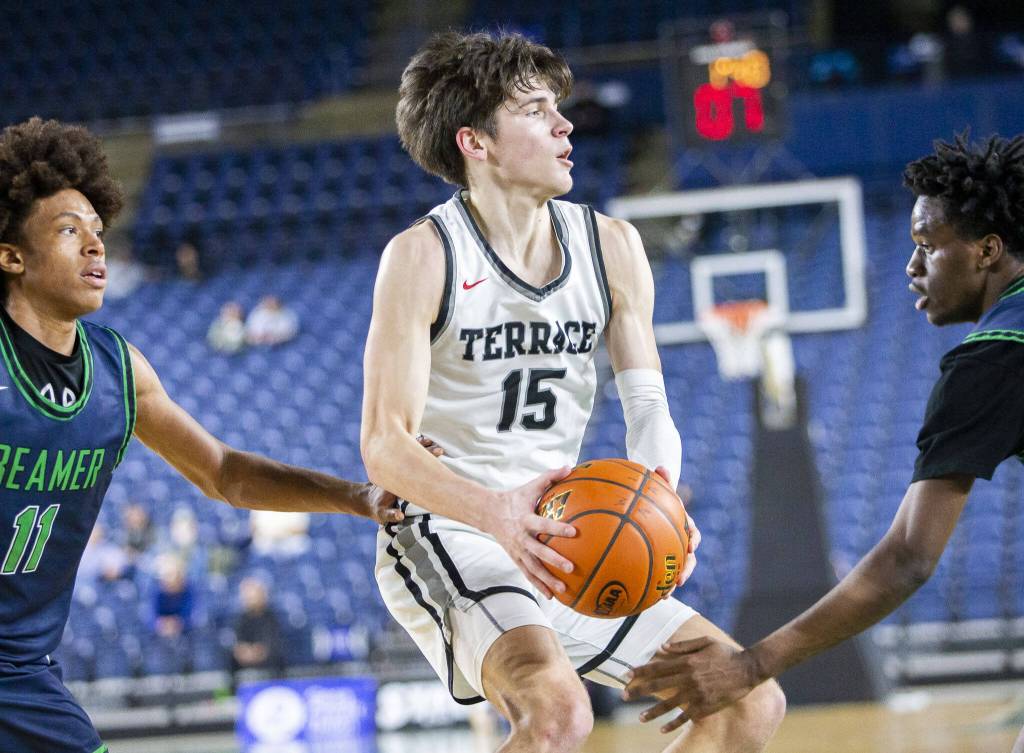 Mountlake Terraces Jaxon Dubiel looks for a teammate to pass too while being guarded during the 3A boys state basketball game against Todd Beamer on Wednesday, Feb. 28, 2024 in Tacoma, Washington. (Olivia Vanni / The Herald)