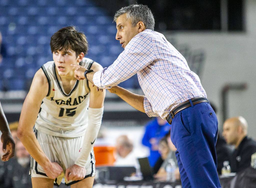 Mountlake Terraces Jaxon Dubiel talks with head coach Nalin Sood during the 3A boys state basketball game against Todd Beamer on Wednesday, Feb. 28, 2024 in Tacoma, Washington. (Olivia Vanni / The Herald)