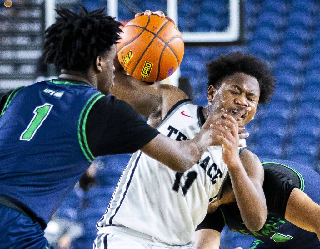 Mountlake Terraces Rayshaun Connor is hit in the face during the 3A boys state basketball game against Todd Beamer on Wednesday, Feb. 28, 2024 in Tacoma, Washington. (Olivia Vanni / The Herald)