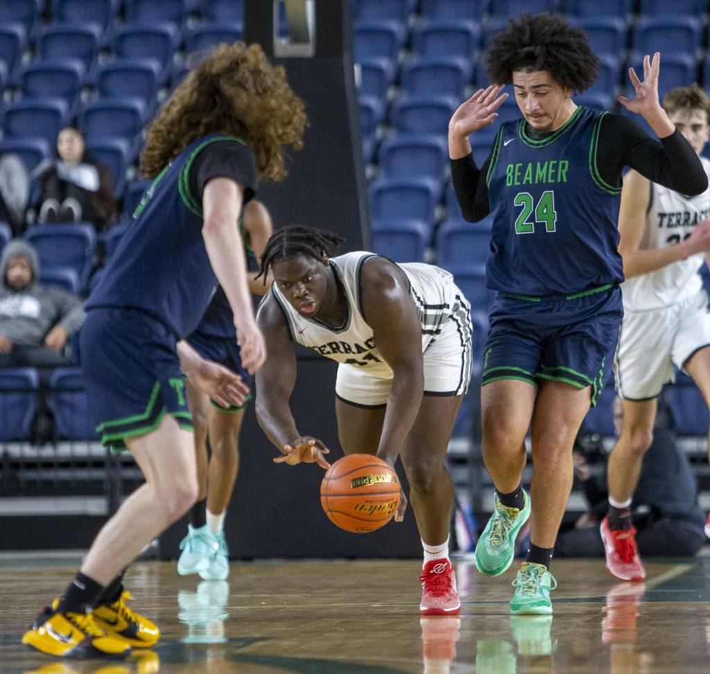 Mountlake Terraces Zaveon Jones scrambles after the ball during the 3A boys state basketball game against Todd Beamer on Wednesday, Feb. 28, 2024 in Tacoma, Washington. (Olivia Vanni / The Herald)
