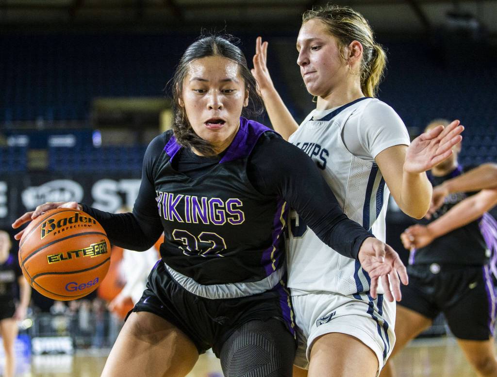 Lake Stevens Keira Tupua maneuvers around a Gonzaga Prep player during the 4A girls state basketball game on Wednesday, Feb. 28, 2024 in Tacoma, Washington. (Olivia Vanni / The Herald)