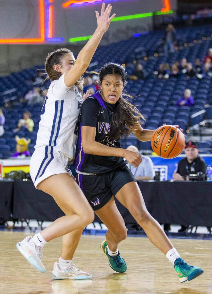 Lake Stevens Noelani Tupua takes the ball down the court during the 4A girls state basketball game against Gonzaga Prep on Wednesday, Feb. 28, 2024 in Tacoma, Washington. (Olivia Vanni / The Herald)