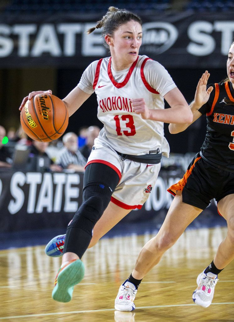 Snohomishs Sienna Capelli takes the ball down the court during the 3A girls state basketball game against Kennewick on Wednesday, Feb. 28, 2024 in Tacoma, Washington. (Olivia Vanni / The Herald)