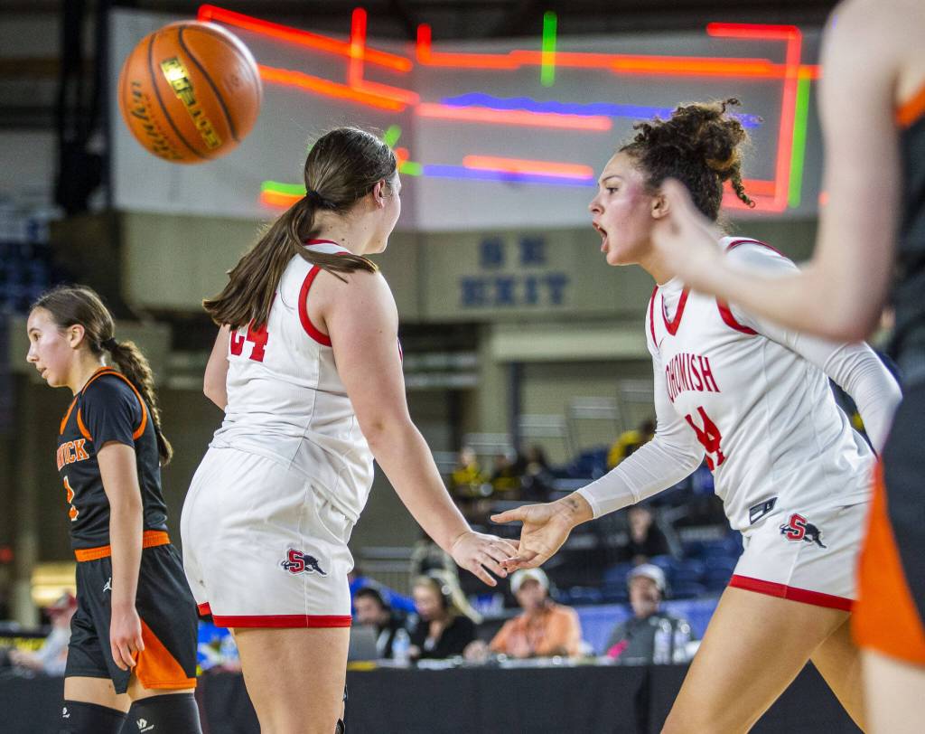 Snohomishs Tyler Gildersleeve-Stiles high-fives her teammate during the 3A girls state basketball game against Kennewick on Wednesday, Feb. 28, 2024 in Tacoma, Washington. (Olivia Vanni / The Herald)