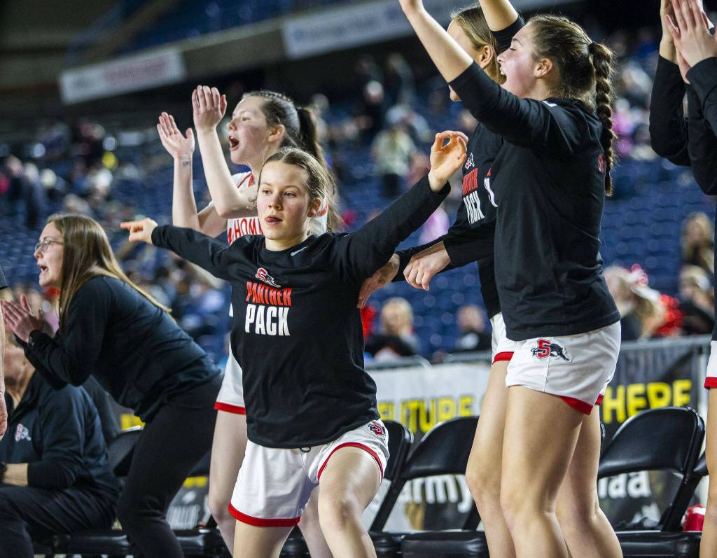 Snohomish players react to a three point shot during the 3A girls state basketball game against Kennewick on Wednesday, Feb. 28, 2024 in Tacoma, Washington. (Olivia Vanni / The Herald)