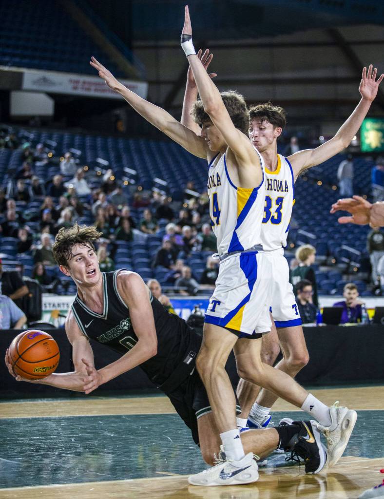 Jacksons Ryan Mcferran falls to the ground during the 4A boys state basketball game against Tahoma on Wednesday, Feb. 28, 2024 in Tacoma, Washington. (Olivia Vanni / The Herald)