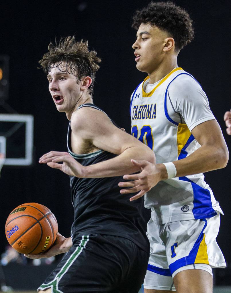 Jacksons Ryan Mcferran tries to maneuver around a Tahoma player during the 4A boys state basketball game against Tahoma on Wednesday, Feb. 28, 2024 in Tacoma, Washington. (Olivia Vanni / The Herald)