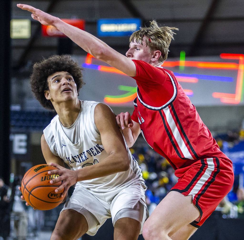 Glacier Peaks Jayce Nelson looks for an open shot during the 4A boys state basketball game against Camas on Wednesday, Feb. 28, 2024 in Tacoma, Washington. (Olivia Vanni / The Herald)