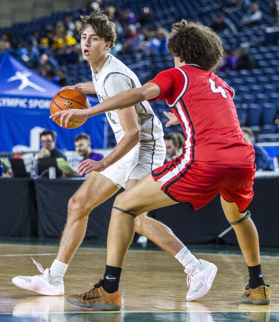 Glacier Peaks Jo Lee takes the ball down the court during the 4A boys state basketball game against Camas on Wednesday, Feb. 28, 2024 in Tacoma, Washington. (Olivia Vanni / The Herald)